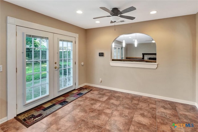 608 Chimney Rock Dr, Victoria, TX 77904 - entryway featuring french doors, ceiling fan, recessed lighting, baseboards, and arched walkways