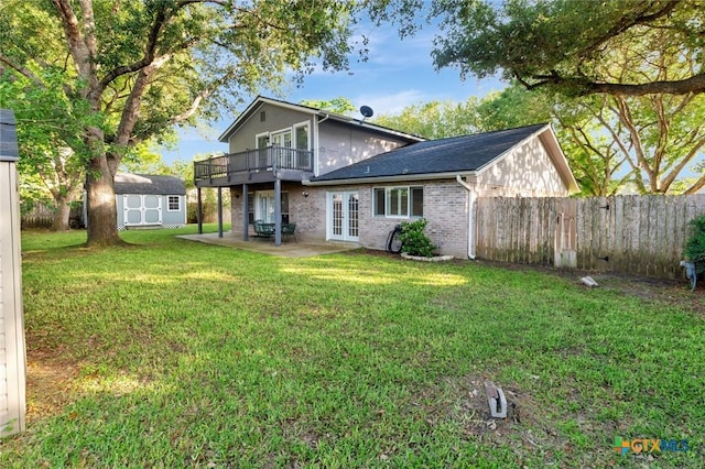 608 Chimney Rock Dr, Victoria, TX 77904 - rear view of property with french doors, a storage shed, an outbuilding, a patio, and brick siding