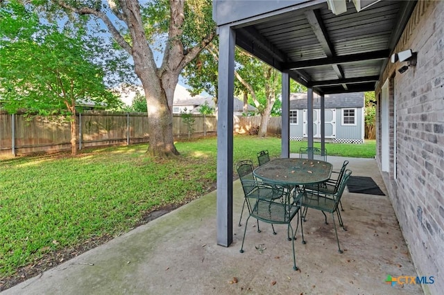 608 Chimney Rock Dr, Victoria, TX 77904 - view of patio with a shed, an outdoor structure, and outdoor dining area