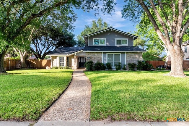 608 Chimney Rock Dr, Victoria, TX 77904 - traditional-style house with brick siding and roof with shingles