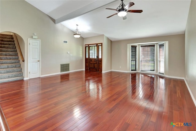 608 Chimney Rock Dr, Victoria, TX 77904 - unfurnished living room with baseboards, a ceiling fan, stairway, wood-type flooring, and beam ceiling
