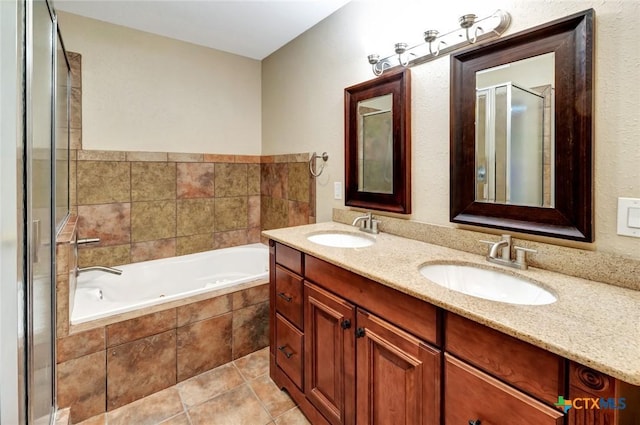 608 Chimney Rock Dr, Victoria, TX 77904 - full bathroom with a garden tub, a shower stall, double vanity, and tile patterned floors