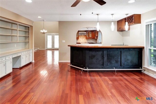 608 Chimney Rock Dr, Victoria, TX 77904 - kitchen with dark wood-type flooring, recessed lighting, ceiling fan, and hanging light fixtures