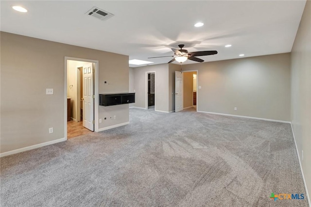 608 Chimney Rock Dr, Victoria, TX 77904 - unfurnished living room with ceiling fan, light colored carpet, recessed lighting, and baseboards