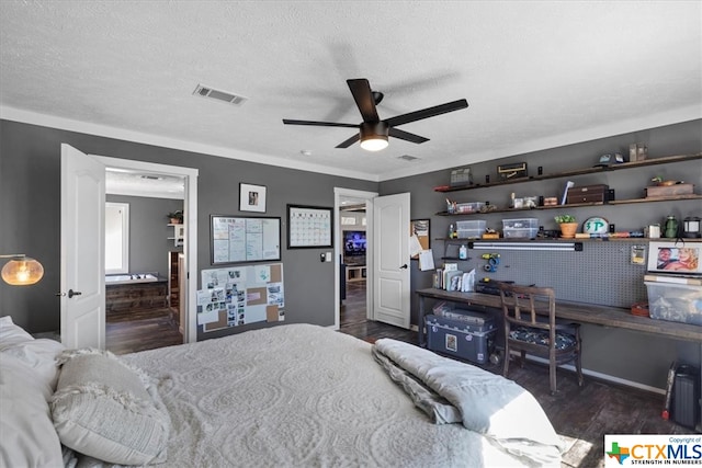 bedroom with ceiling fan, dark hardwood / wood-style floors, and a textured ceiling