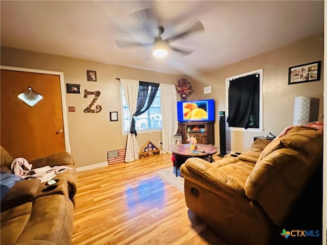 27 County Road 398, TX 77987 - living area with light wood-style floors, baseboards, and ceiling fan