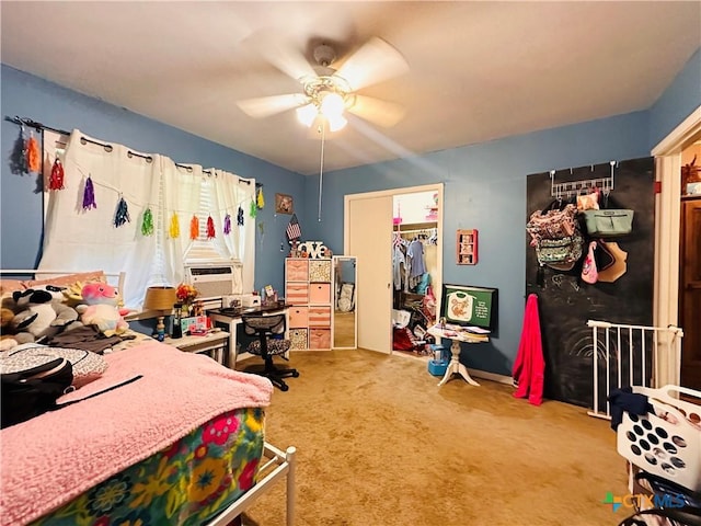 27 County Road 398, TX 77987 - carpeted bedroom featuring a ceiling fan, cooling unit, a spacious closet, and a closet