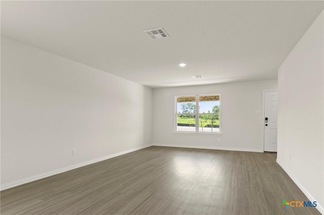 3820 Keller Rd, Temple, TX 76504 - empty room featuring dark wood-type flooring and recessed lighting
