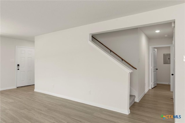 3820 Keller Rd, Temple, TX 76504 - empty room with stairs, light wood-type flooring, and electric panel