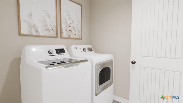 3820 Keller Rd, Temple, TX 76504 - laundry area featuring baseboards, laundry area, and washer and clothes dryer