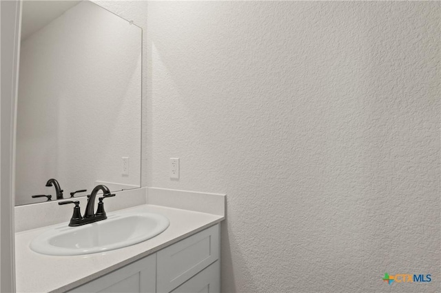 3820 Keller Rd, Temple, TX 76504 - bathroom featuring vanity and a textured wall