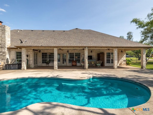 view of pool featuring ceiling fan and a patio area