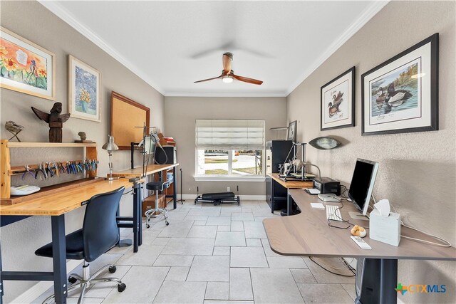 office space with crown molding, ceiling fan, and light tile patterned flooring