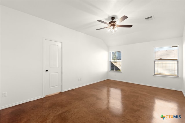 empty room with ceiling fan and lofted ceiling