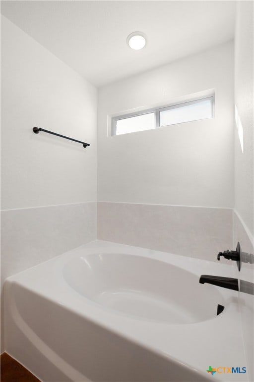 bathroom with a washtub