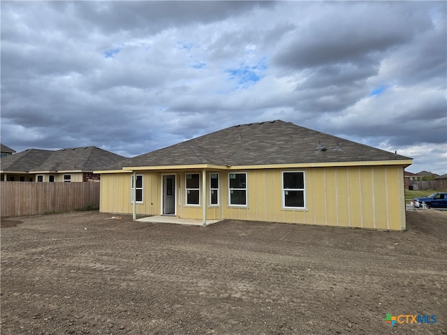 back of property with a patio area