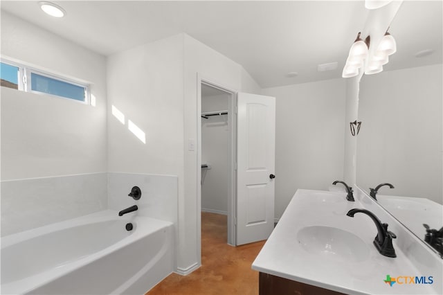 bathroom with a bath and vanity