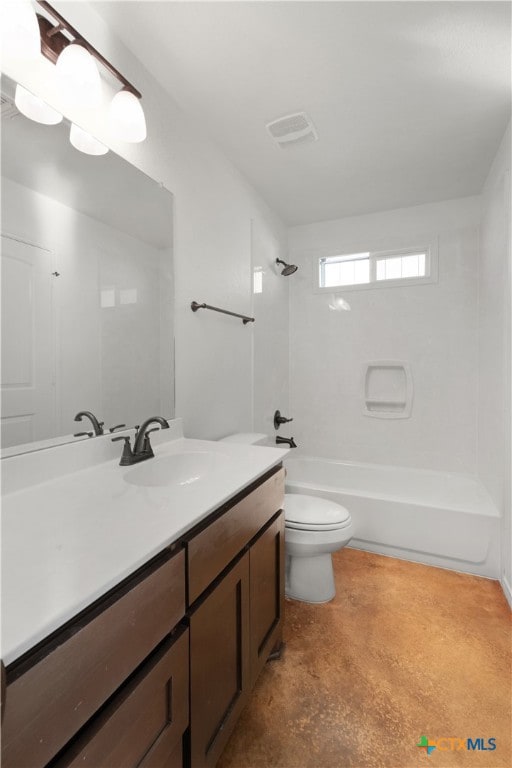 full bathroom with tiled shower / bath, vanity, and toilet