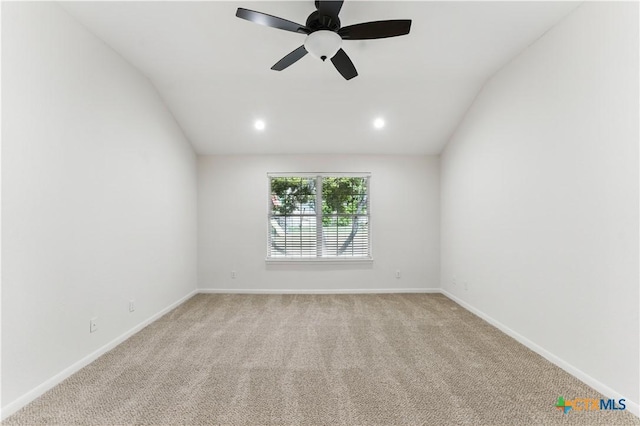 spare room featuring ceiling fan, light carpet, baseboards, lofted ceiling, and recessed lighting