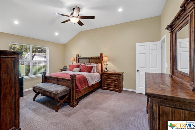 bedroom with light colored carpet, vaulted ceiling, and ceiling fan