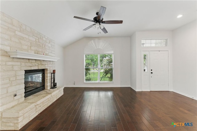 unfurnished living room featuring wood-type flooring, a fireplace, a ceiling fan, and baseboards