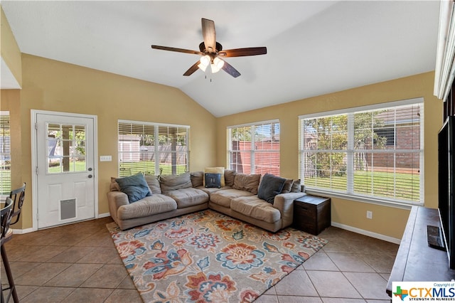 living room with ceiling fan, light tile patterned flooring, and vaulted ceiling