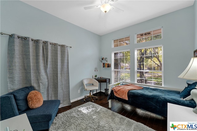 bedroom with ceiling fan and dark hardwood / wood-style floors