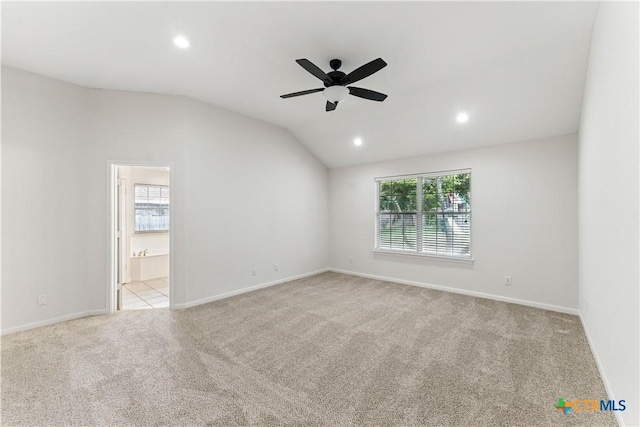carpeted spare room with recessed lighting, lofted ceiling, a ceiling fan, and baseboards