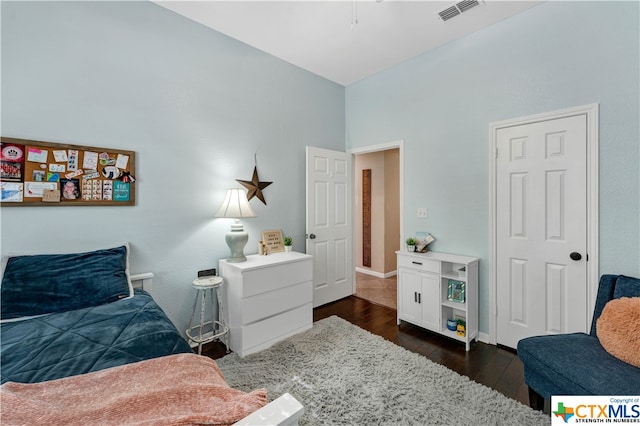 bedroom featuring dark wood-type flooring