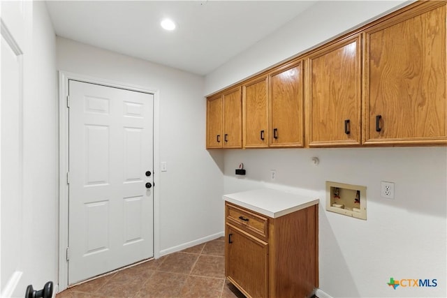 laundry area featuring tile patterned floors, baseboards, recessed lighting, washer hookup, and cabinet space
