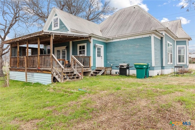 302 Avenue N, Marble Falls, TX 78654 - rear view of property featuring metal roof, a yard, and a porch