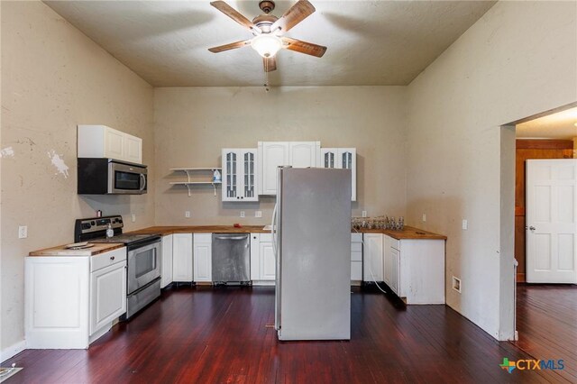 302 Avenue N, Marble Falls, TX 78654 - kitchen featuring glass insert cabinets, white cabinets, dark wood finished floors, and appliances with stainless steel finishes