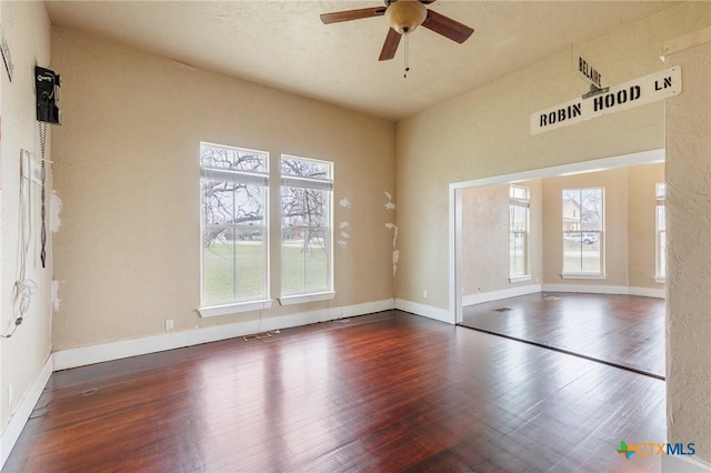 302 Avenue N, Marble Falls, TX 78654 - empty room with wood finished floors, a ceiling fan, and baseboards