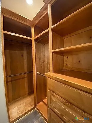 spacious closet featuring hardwood / wood-style floors