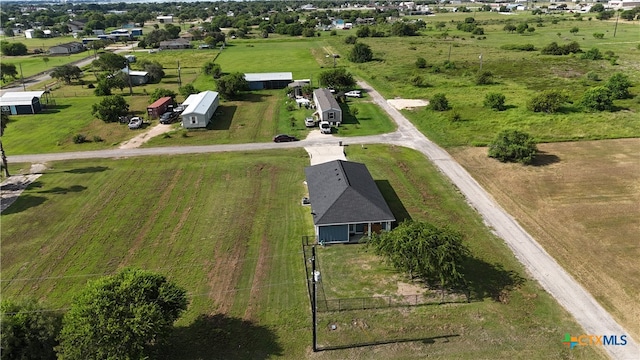 birds eye view of property featuring a rural view