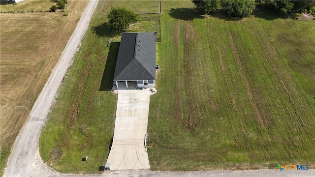 birds eye view of property with a rural view