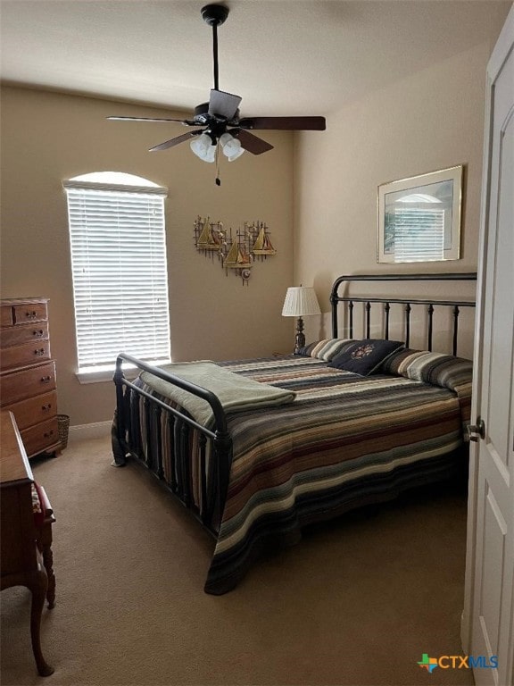 bedroom featuring carpet and ceiling fan