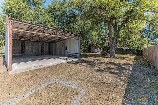 view of shed featuring fence