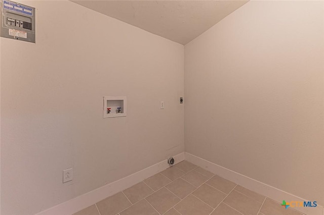 washroom featuring light tile patterned floors, hookup for a washing machine, hookup for an electric dryer, laundry area, and baseboards