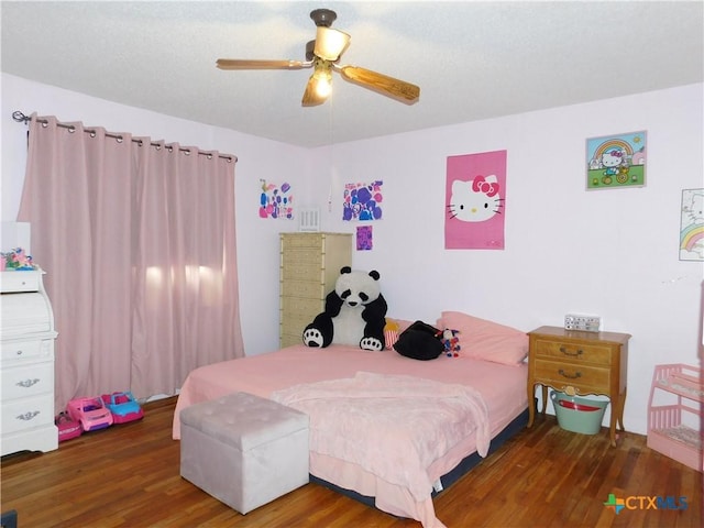 bedroom featuring ceiling fan and dark hardwood / wood-style floors