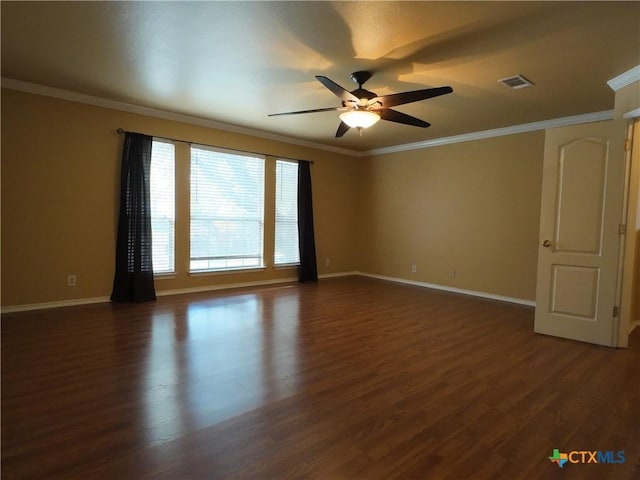 spare room with ceiling fan, dark hardwood / wood-style flooring, and crown molding