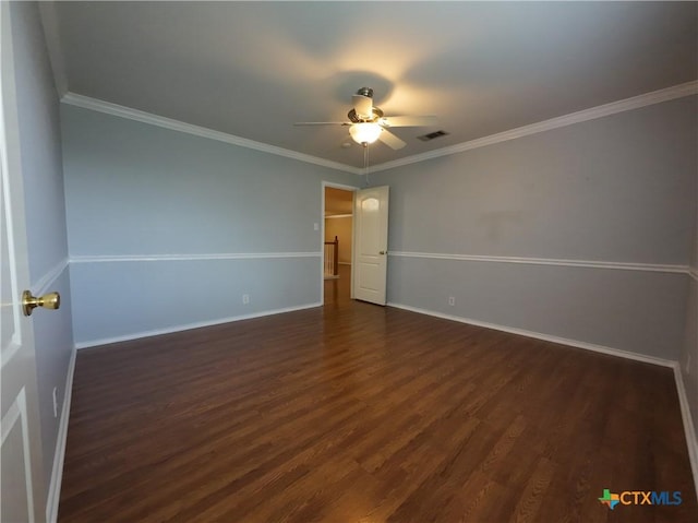 interior space featuring ceiling fan, ornamental molding, and dark wood-type flooring