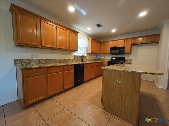 kitchen featuring black appliances, sink, light stone countertops, light tile patterned floors, and a kitchen island