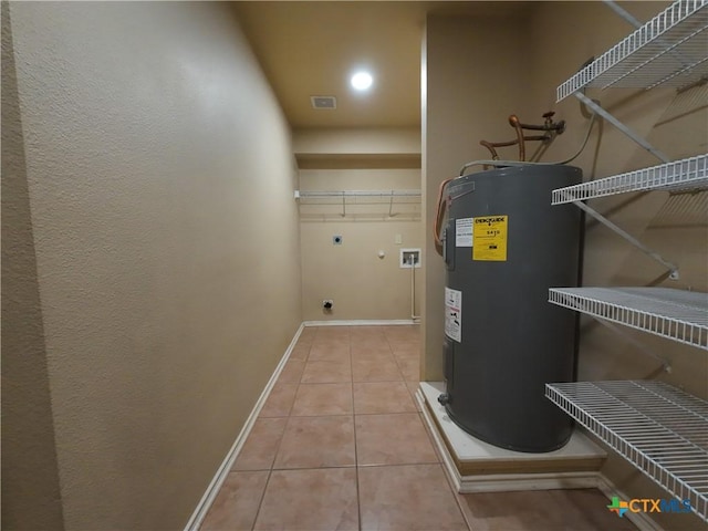 utility room featuring electric water heater