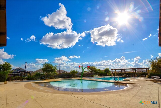 view of pool featuring a patio