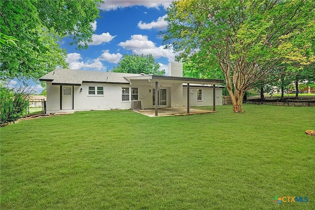 906 Laurie Ln, Copperas Cove, TX 76522 - rear view of house with a chimney, a patio area, and a lawn