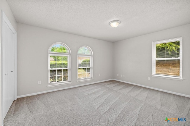 906 Laurie Ln, Copperas Cove, TX 76522 - empty room featuring carpet flooring and a textured ceiling