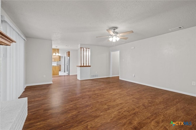 906 Laurie Ln, Copperas Cove, TX 76522 - unfurnished living room with a textured ceiling, a chandelier, wood finished floors, and a ceiling fan