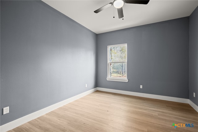 unfurnished room with ceiling fan and light hardwood / wood-style floors