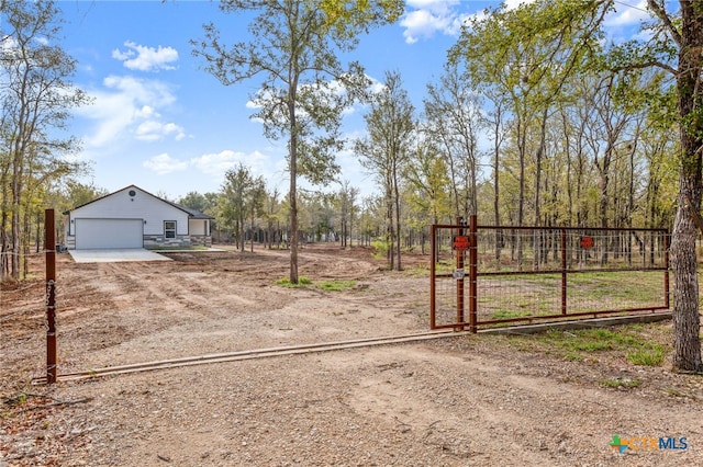 view of gate with an outdoor structure